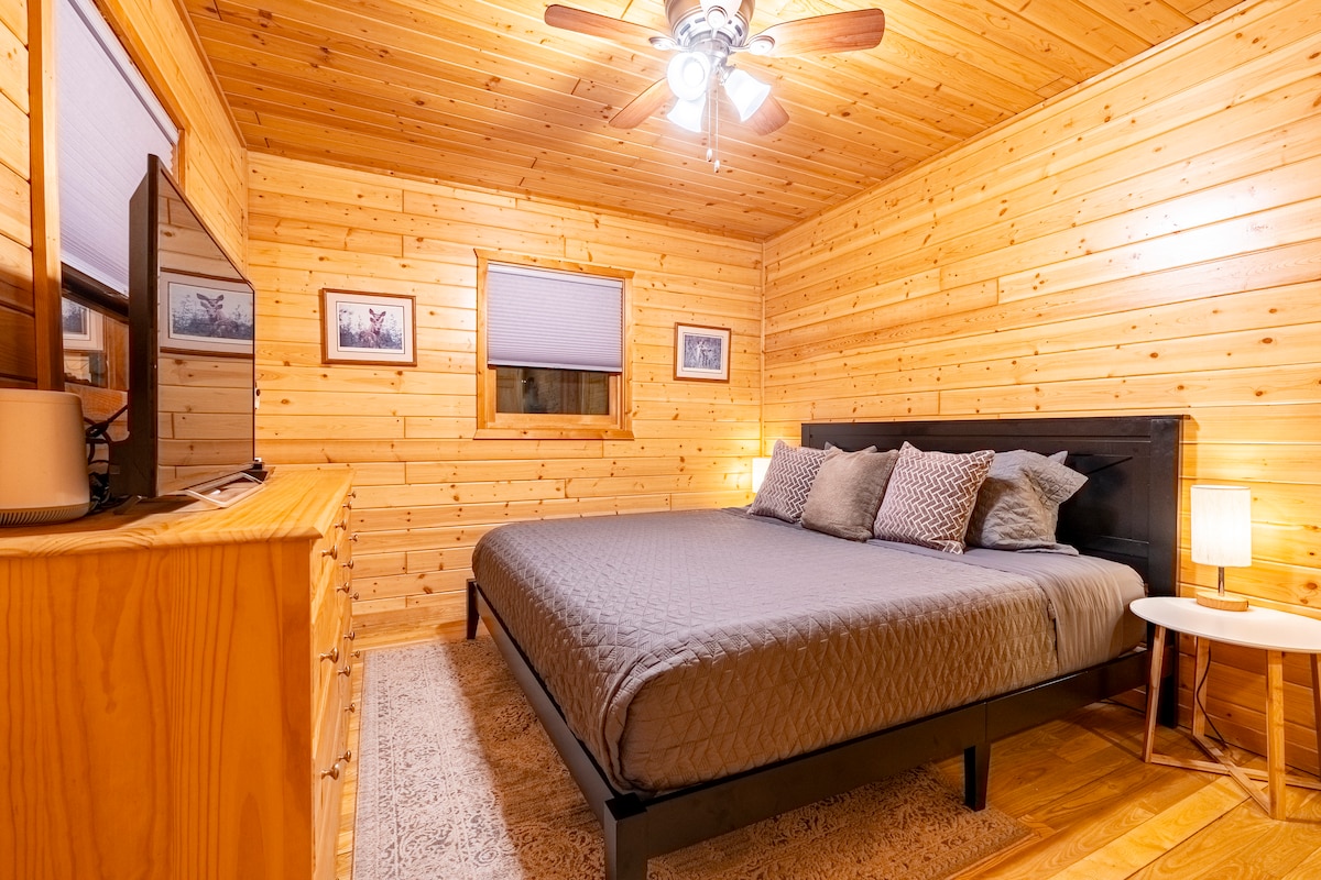 Main Floor Bedroom King Sized Bed! Smart TV, dresser, touch lamps, and more