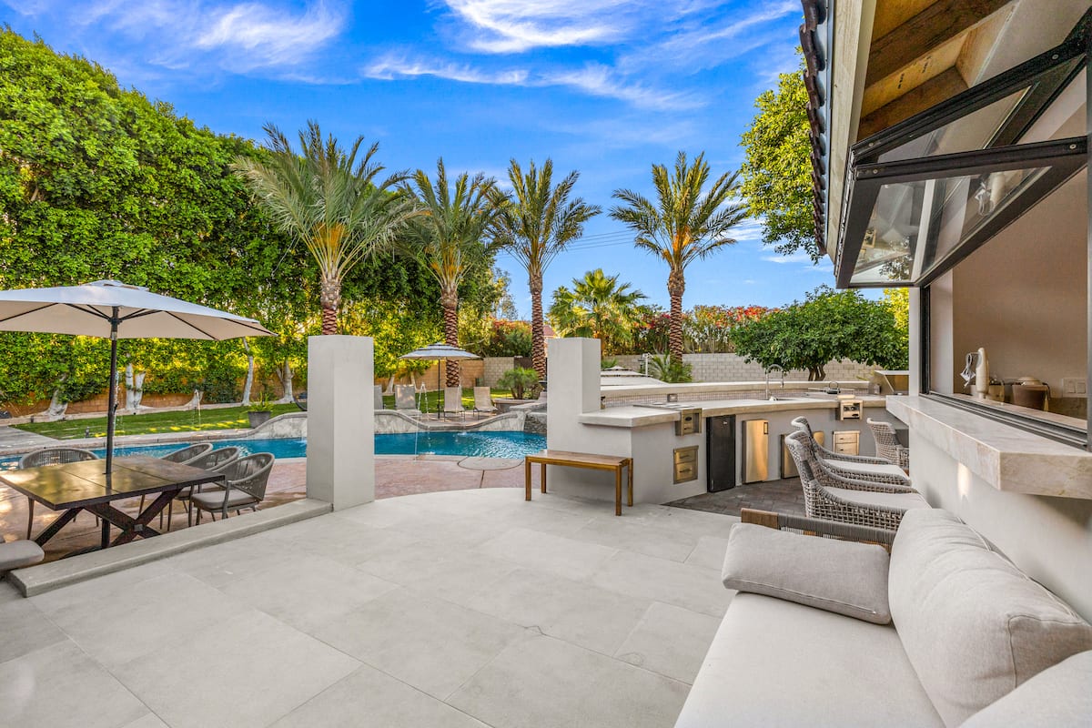 Covered patio lounge looking out to the pool