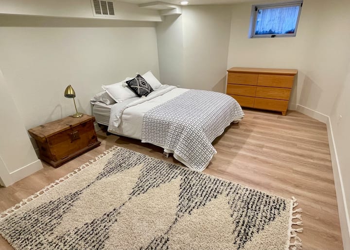 Full bedroom with queen bed in basement. Recently remodeled, new floors.