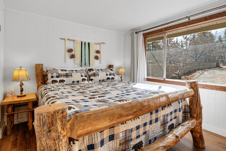 Master bedroom with Cal-king, memory foam mattress, and bedside lights with climbing bears and USB ports.