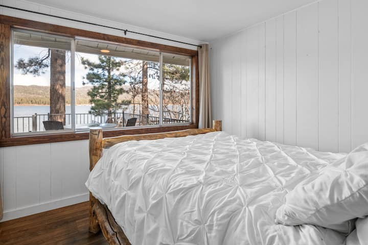 Bedroom 2 with large windows to enjoy the head-on lake views.
