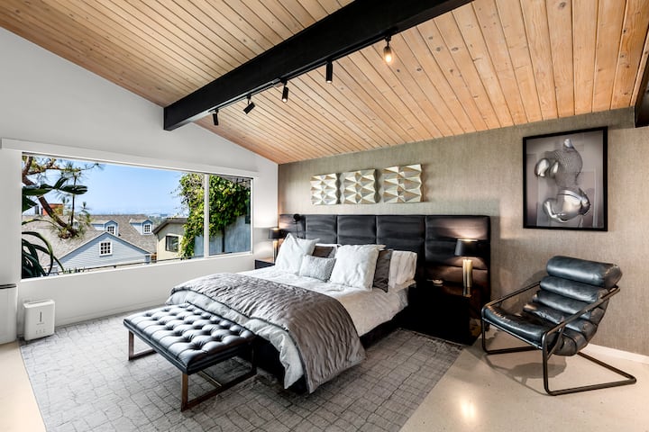 Comfort and style in this large primary bedroom with attached spa like bathroom with stone soaking tub, private smart toilet and steam!