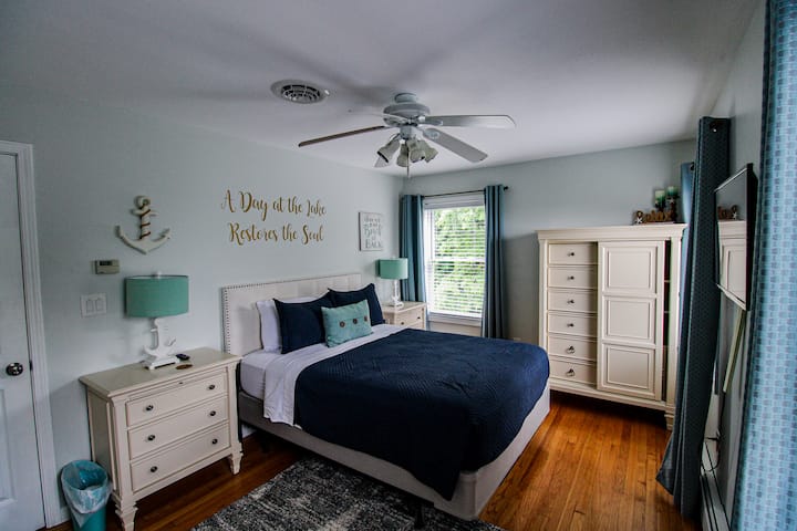Bedroom with queen sized bed on main level of the house.