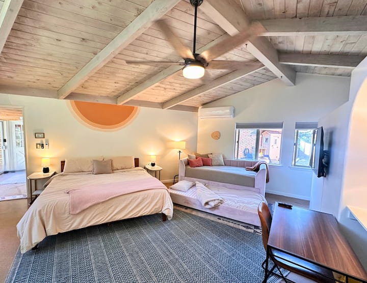 Spacious primary bedroom on separate wing of the house, with king size bed, twin daybed with twin trundle.  100% cotton sheets, separate walk-in closet, desk and ensuite bathroom. Smart TV with Disney+ and Hulu streaming included. 