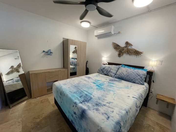 The secondary bedroom has a wardroom and dresser to store your items. 

We have provided both boho (tie dye) and regular linens and plenty of extra pillows. 

Bedside shelves and lights make night time reading easy. 