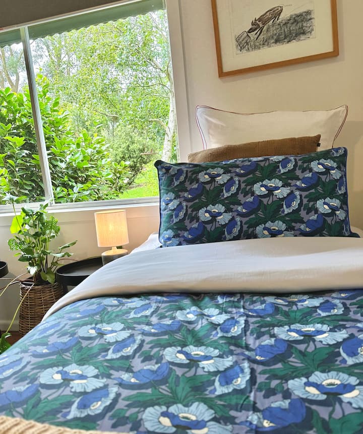 Take a moment to unwind & enjoy the stunning view of our picturesque garden, especially our gorgeous fig tree. Our spacious room features two comfortable king single beds with electric blankets & plush pillows, ensuring you have a restful sleep.