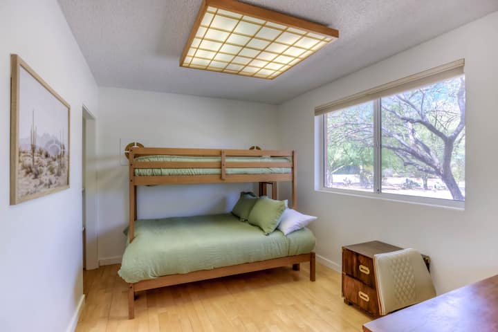 Private office and bedroom off the main entry including desk, chair and twin over full bunk bed.