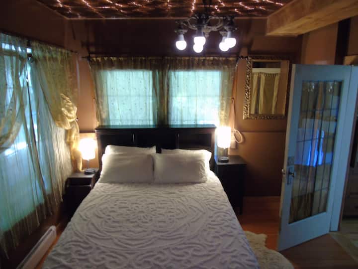 Queen bed. Side lamps with USB chargers.