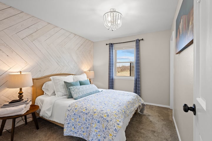 Main level queen bedroom. Shared full bathroom across the hall. 