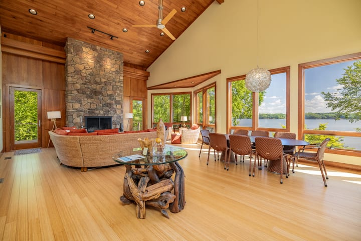 Living room and dining room area with lake views