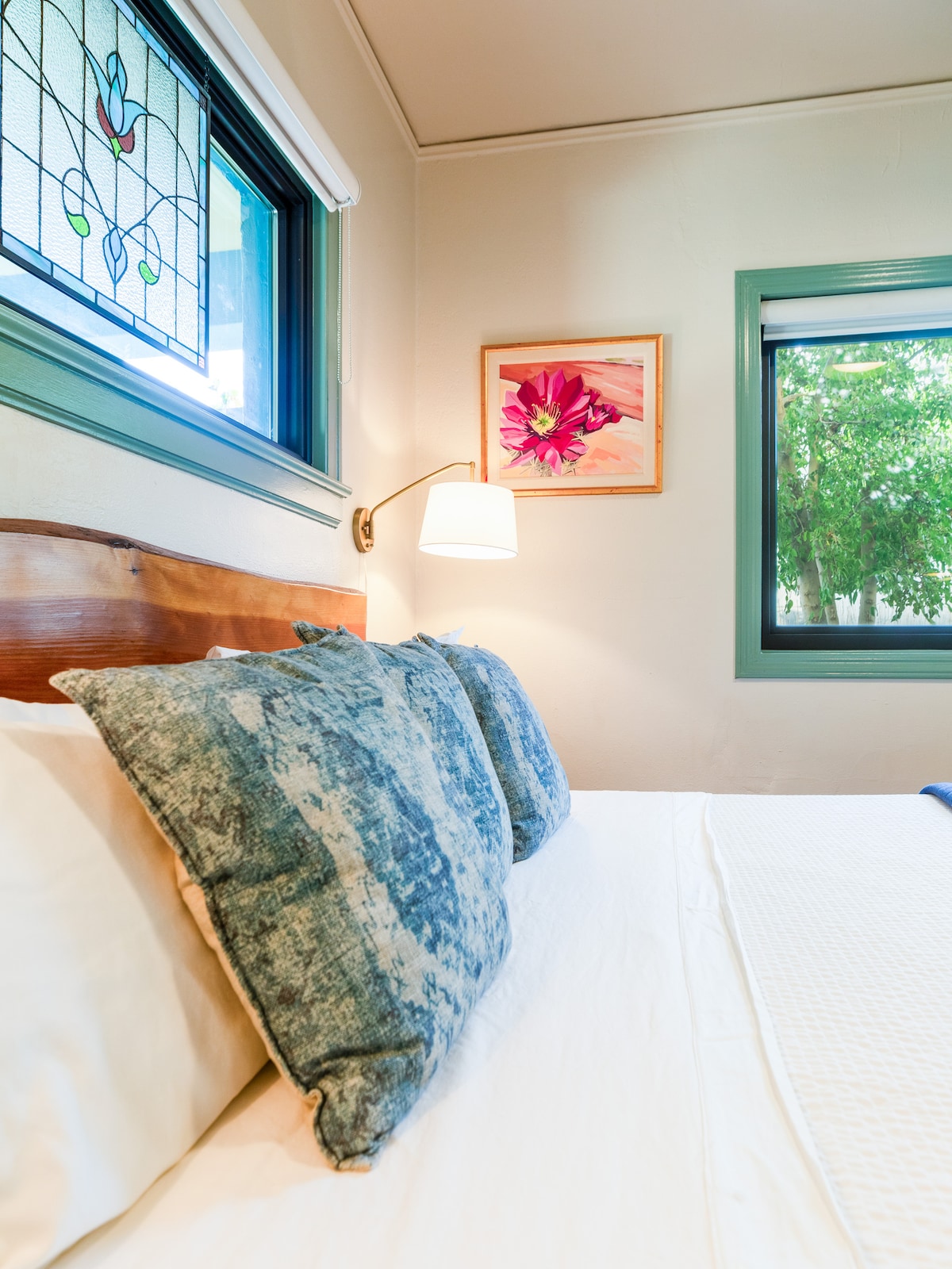 Experience deep rest with a king-sized bed adorned with local art, high-quality bedding, blackout shades, sound machines, and an en-suite bathroom.