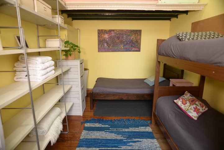 Bedroom 3 has 3 single beds.