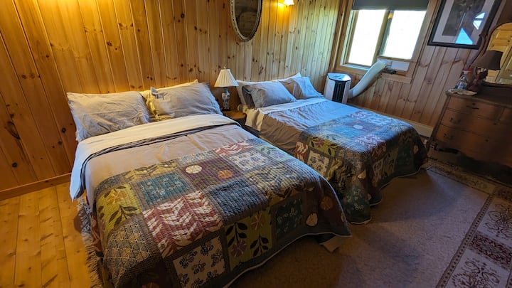 The second loft bedroom has 2 double beds and an air conditioner for hot evenings.  There is a dresser as well as a closet for your clothes (sheets and towels available on request($$)