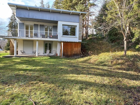 House between lakes and mountains.