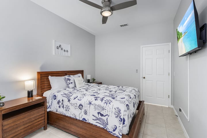 Bedroom 2 offers a full sized bed, beautiful decor and 2 entrances for an open, airy feel. 