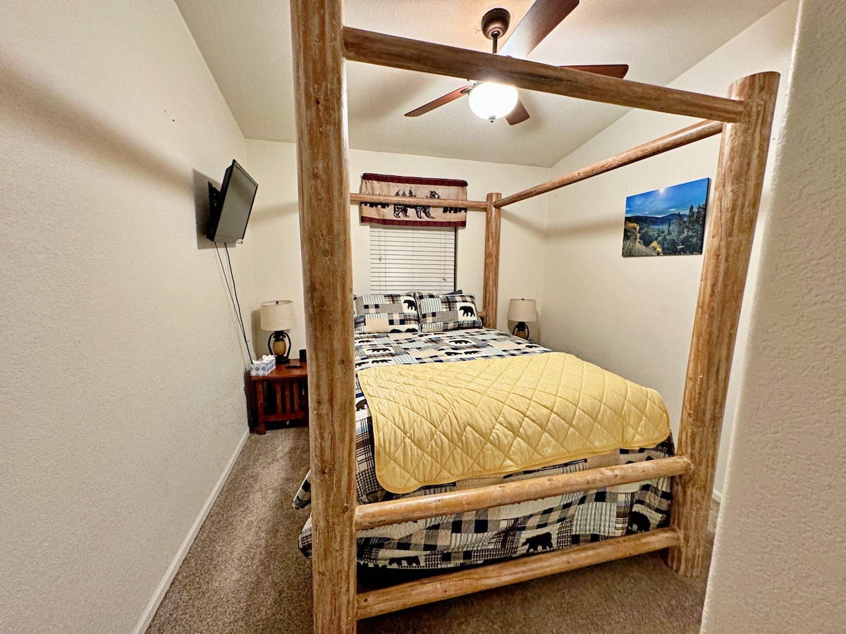 The 3rd bedroom at Almost Bearadise offers a queen luxury plush pillow-top mattress on a log canopy bed. The closet’s stocked with a Pack 'n Play, changing pad, dog basket, fan, and heaters—comfort and convenience for all your needs!