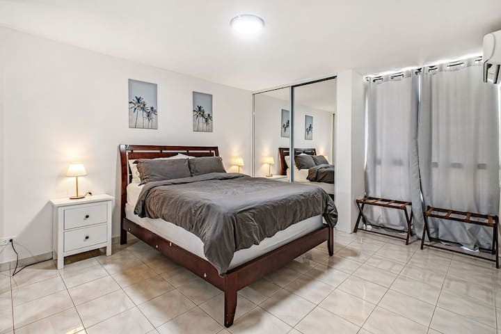 Our third and master bedroom which includes a queen size bed, two closets with hangers, two luggage racks, A/C unit, master bathroom, and water views to the Alambique Beach at Isla Verde. 