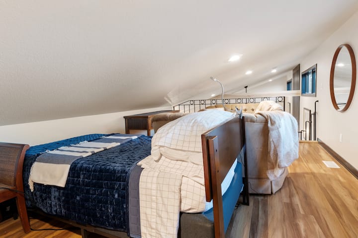 The loft space has 2 single beds and a small seating area for 4 people. There are also board games in the loft.