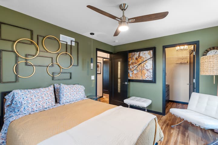 Primary bedroom has the extra storage, laundry detergent, and cleaning supplies stored in the large closet.  And it has a sliding door out the back to access the upper deck.