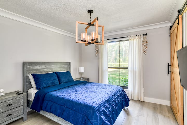 Our second guest bedroom boasts a comfortable queen-size plush bed, ensuring a restful night’s sleep.