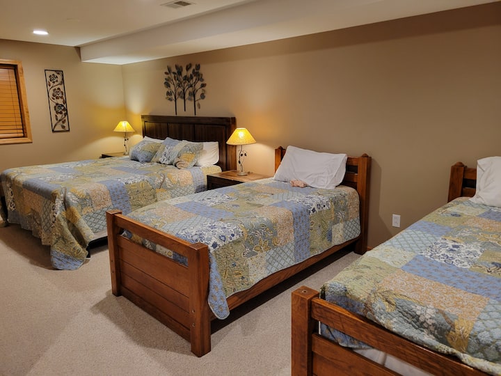 Newly finished basement bedroom with a king and 2 twins. 