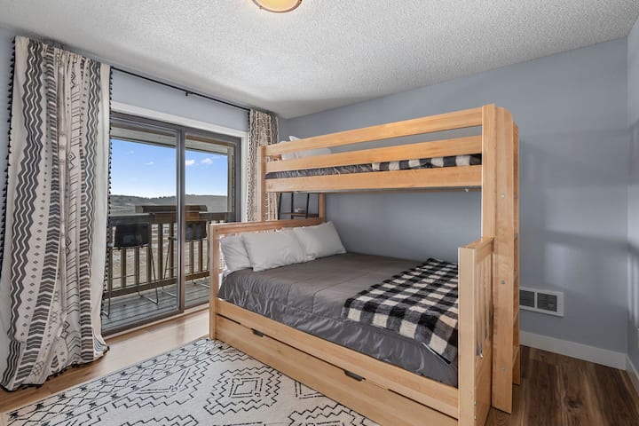 2nd Bedroom: Queen bed, twin top bunk, and twin trundle. Walk out to the balcony.