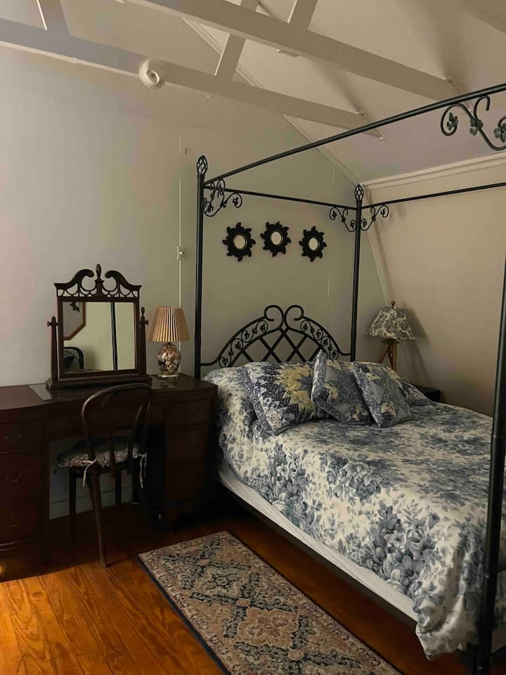 Full bed with an adjoining 2nd bedroom (Family Suite) with only portable fan but air conditioned if adjoining room leaves door open.  Hallway to adjoining room is in this room but separated with curtain. 2nd floor