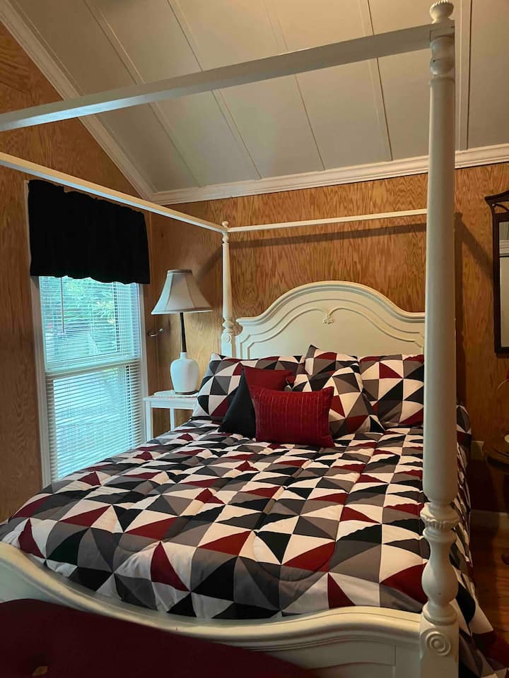 Private bedroom with door and air conditioner but requires walking through another bedroom with curtain divider hallway. Both bedrooms great for parents with small children. Adjoining bedroom appreciates open door for air conditioning. 2nd Floor. 