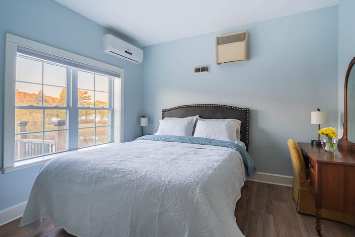 This room overlooks Westport Pond, where locals fish in summer and skate in winter. With a view of Foley Mountain and the soothing sound of a waterfall, it offers a queen-size bed, a full bathroom, and a peaceful, restful atmosphere.