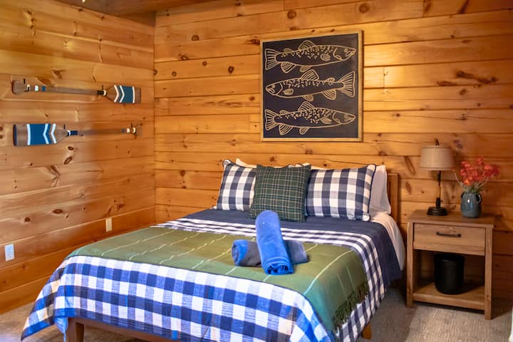 Bring the lakeside charm indoors! Unwind in our first-floor bedroom with a queen bed, complemented by a comfortable mattress and delightful pillows and linens.