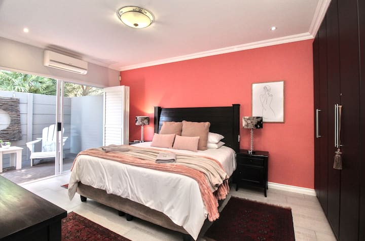 Enjoy a comfortable king-size bed with luxurious blankets for warmth, plus air conditioning for those hot or cold nights