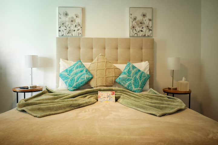 Main bedroom with a queen size bed for 1 or 2 guests, maybe a child. 