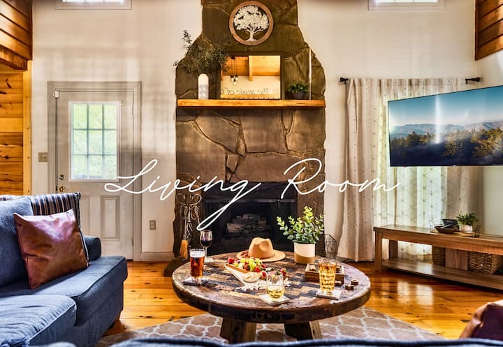 Kick back in the inviting living room featuring plush seating, a cozy fireplace, and plenty of space to relax after a day of exploring.