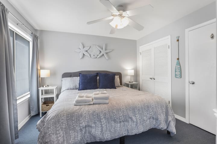 Drift to sleep in this peaceful coastal retreat, soft linens, calming tones, and pure relaxation.