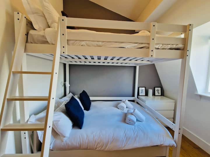 Bedroom three accommodates four people in a unique high sleeper double room.