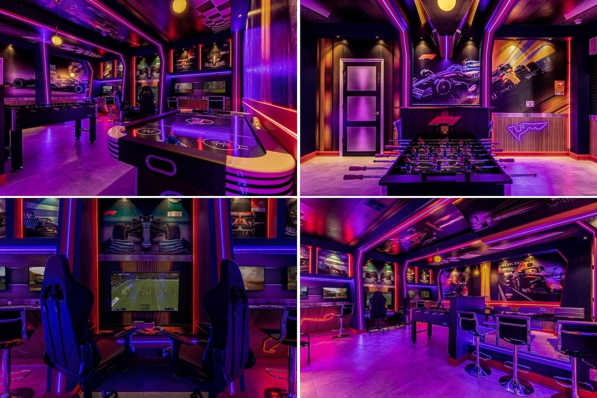 A vibrant game room is equipped with dynamic lighting and multiple entertainment options. Pool tables and arcade games are positioned throughout, complemented by comfortable seating. Multiple screens display racing visuals, creating an immersive gaming experience that appeals to guests of all ages.