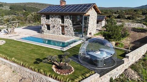 Extraordinary high ceiling corner glass stone villa