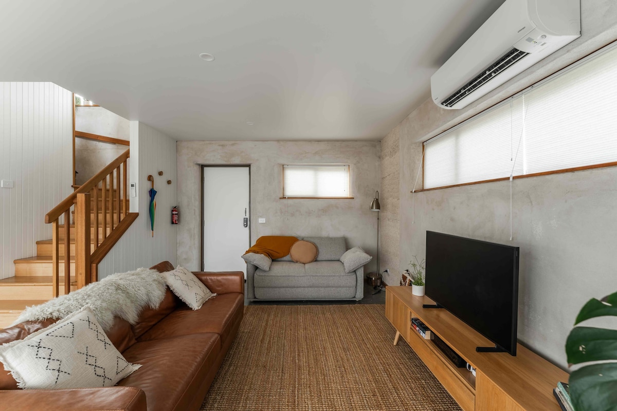 Award winning KOALA brand grey futon style sofa bed in living room