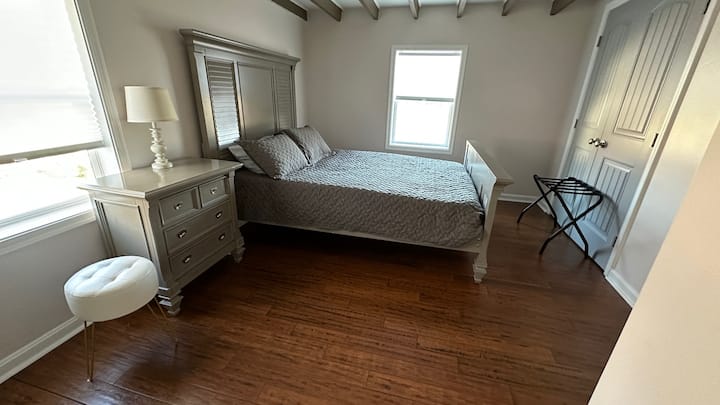 This upstairs bedroom has a queen bed with memory foam mattress, new pillows, and a closet.