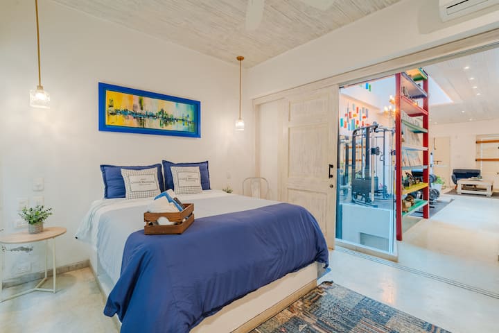 Master bedroom with queen-size bed and private bathroom