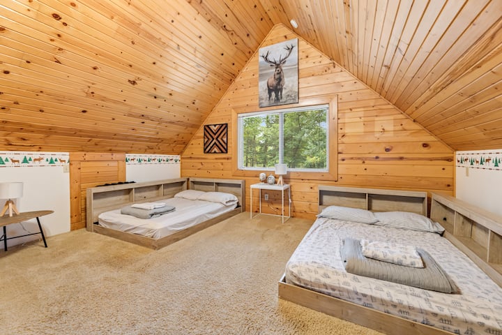 Side View of 4th Bedroom Space. Please Note, this space is a loft above the kitchen. Two full beds and a sleeper sofa. Sleeps 6. There is also a smaller TV in this area. Intended to be a kids space.
