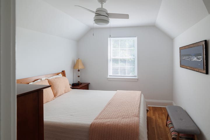 The 2nd bedroom has a window overlooking the backyard. The picture on the wall is of Sandstone Falls close to Hinton, WV. 