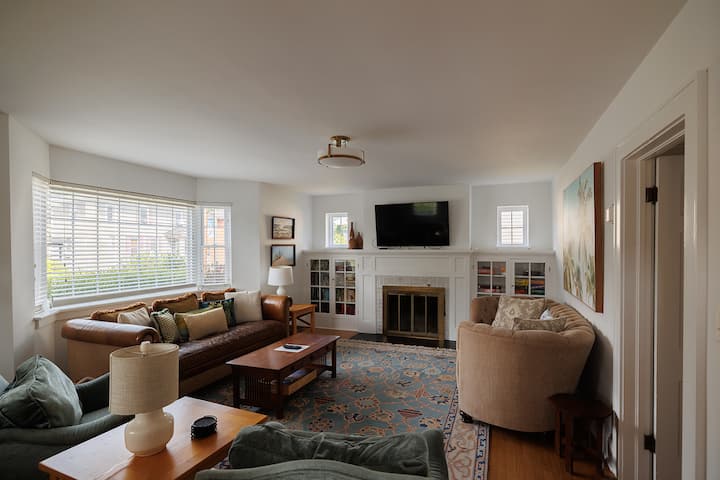 Leather couch and snuggling couch! Perfect room for a game of charades!  