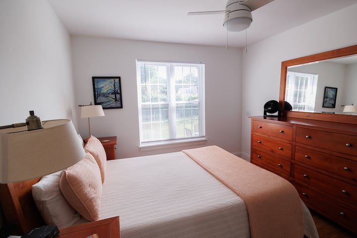 Bedroom 1 is downstairs with a queen bed and bathroom next door. Large closet with pack-n-play.