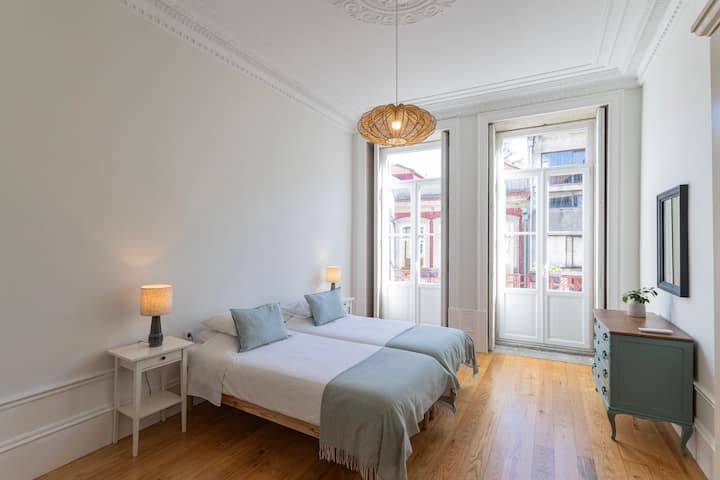 Room with four single beds with partition for greater privacy