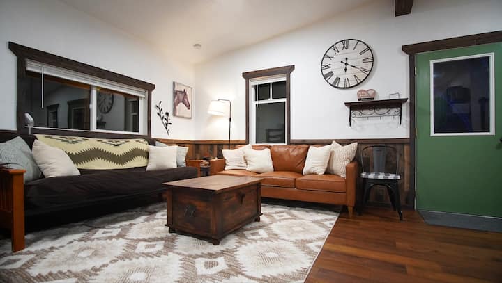 Living room with a very comfortable futon (darker couch).  This space could also be used as another sleeping area during the night time.