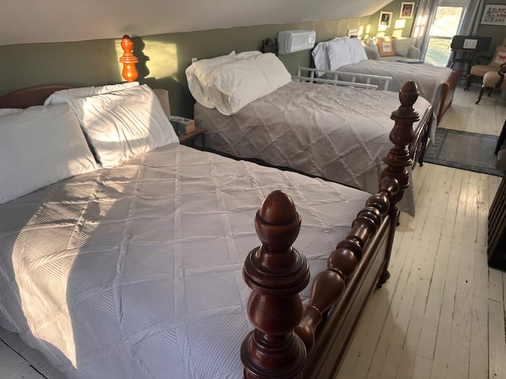 Three full beds are located upstairs.