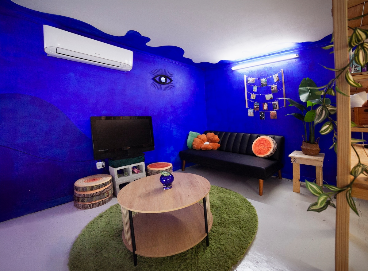 The "Me Time" live/work studio comes with 2 sides: one for rest, and one for play. Thereʻs also a meditation station, private gallery, and hand-painted waterscape mural, perfect for the traveling artist, travel blogger, or even your next staycation.