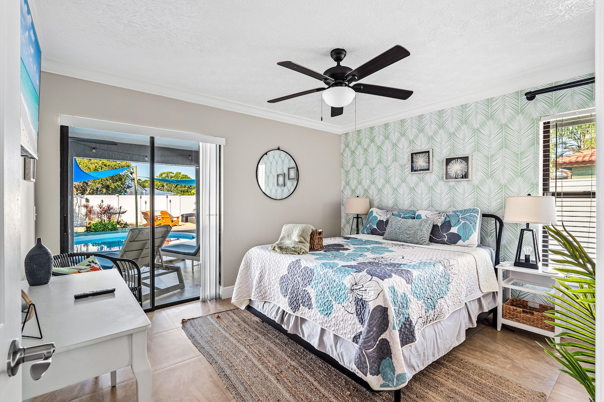 Walk from the Palm Room directly to the outdoor patio and yard. The queen bed and memory foam mattress and blackout curtains will offer you blissful sleep. 