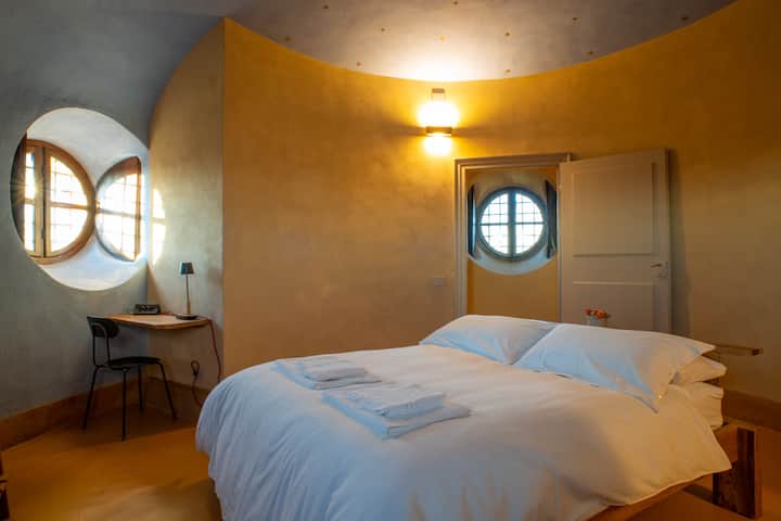1st floor bedroom with private bathroom, desk and hangers. - 1st floor bedroom with private bathroom, desk and coat rack.